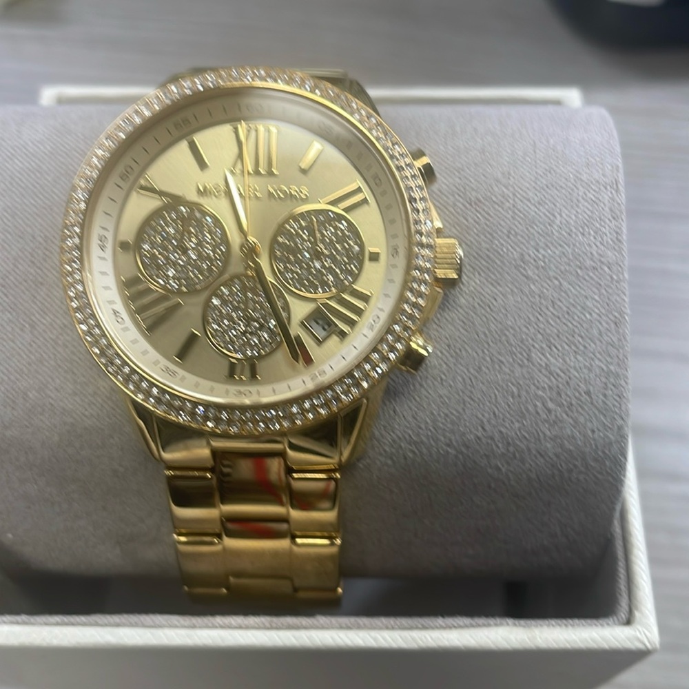 A new authentic rhinestone Minnie Mouse Michael Kors watch for women.